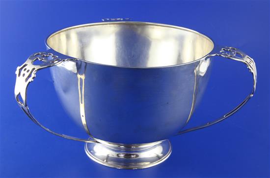 A stylish Edwardian Irish silver pierced tri-handled presentation bowl,